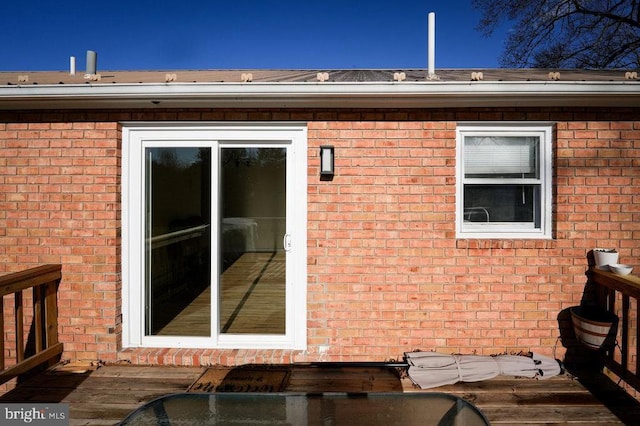 view of side of property with a wooden deck