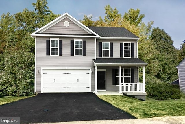 view of front facade featuring a front yard, a porch, and a garage