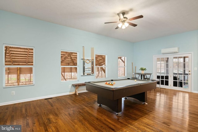 rec room with ceiling fan, french doors, dark wood-type flooring, an AC wall unit, and pool table