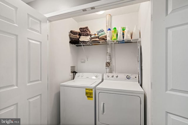 laundry room with washer and clothes dryer