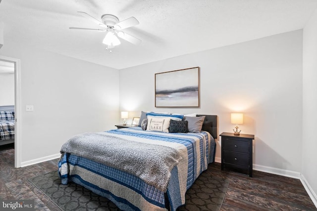 bedroom featuring ceiling fan and dark hardwood / wood-style floors