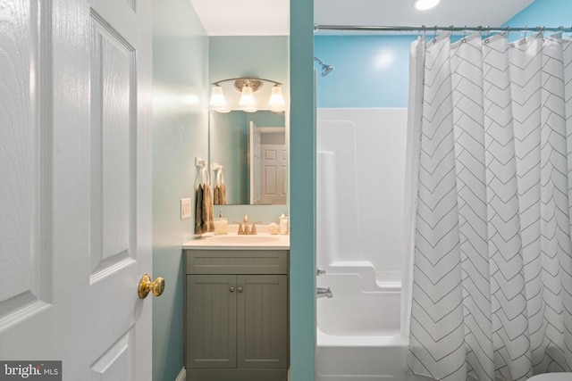 bathroom featuring vanity and shower / bath combination with curtain