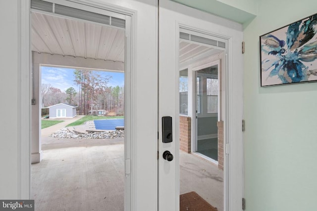 doorway featuring wooden ceiling