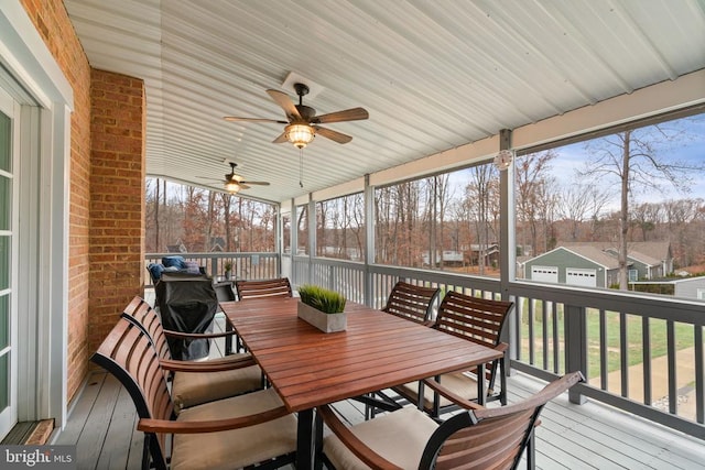 sunroom featuring ceiling fan