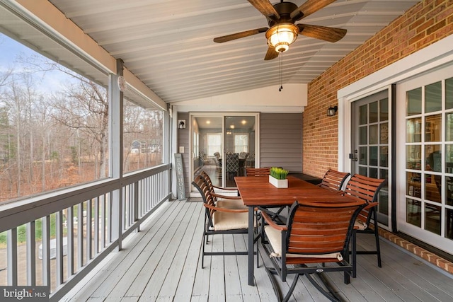 sunroom / solarium featuring vaulted ceiling and ceiling fan