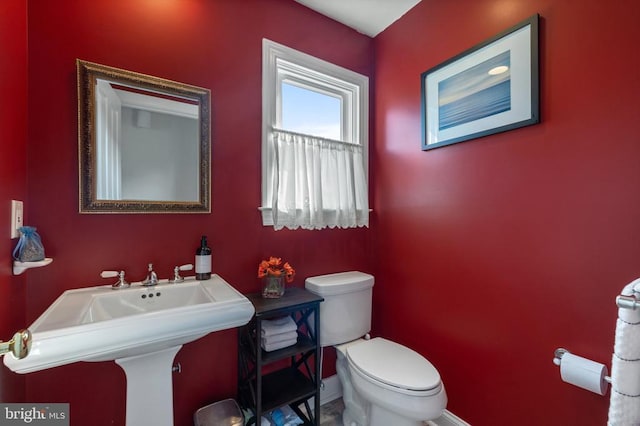 bathroom featuring toilet