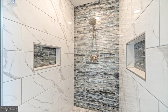 bathroom featuring tiled shower