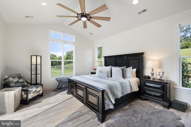 bedroom featuring light hardwood / wood-style flooring and multiple windows