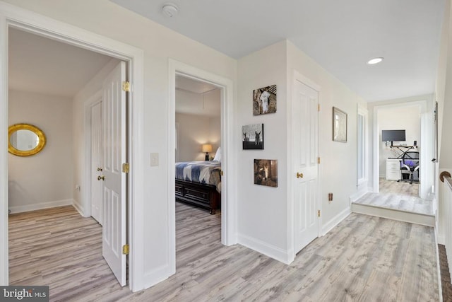 corridor featuring light hardwood / wood-style floors