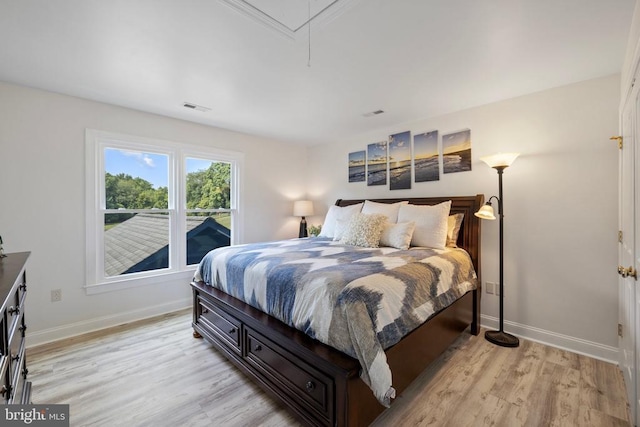 bedroom featuring light hardwood / wood-style floors