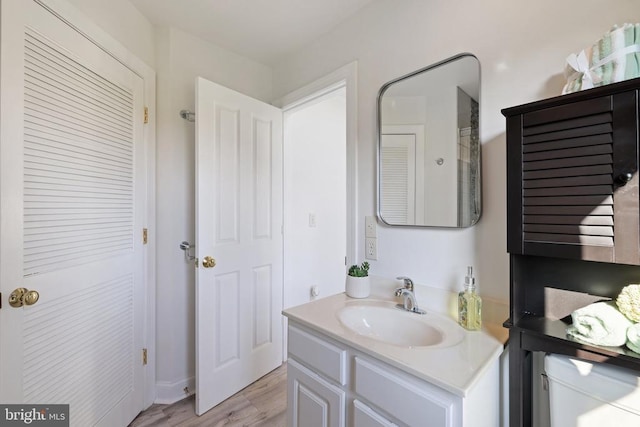 bathroom featuring vanity and hardwood / wood-style flooring