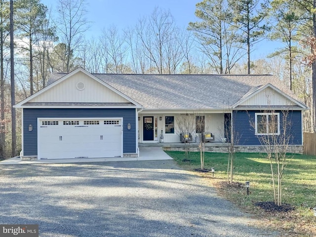 ranch-style house with a front lawn, a porch, and a garage