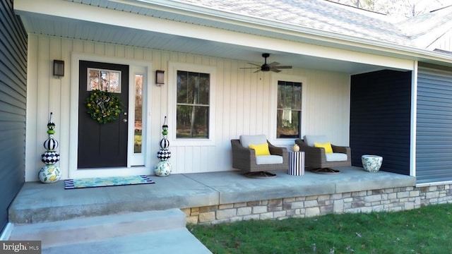 entrance to property featuring a porch and ceiling fan