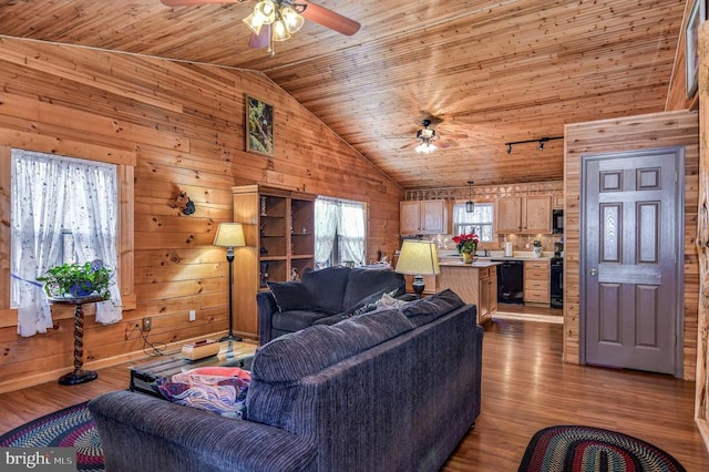 living room featuring wooden ceiling, high vaulted ceiling, wooden walls, ceiling fan, and light hardwood / wood-style floors