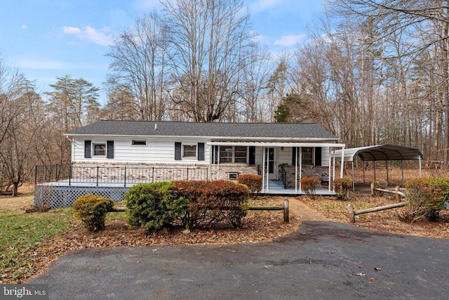 view of front of house featuring a carport and covered porch