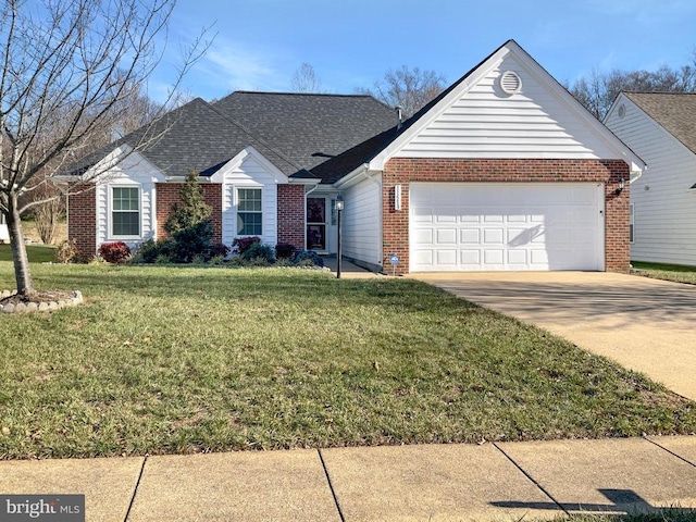 view of front of house featuring a front lawn and a garage