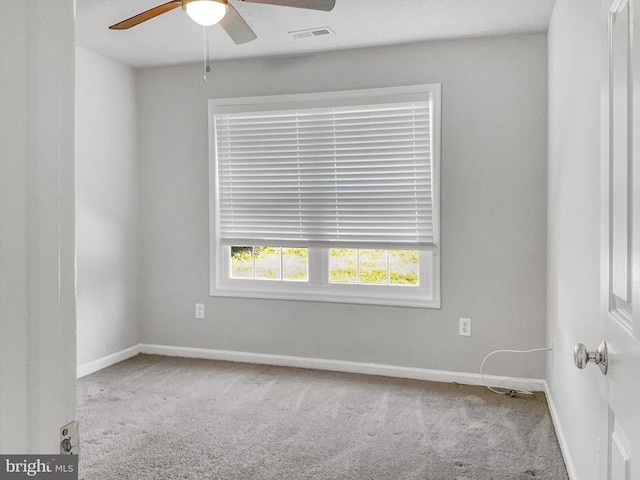 unfurnished room featuring carpet and ceiling fan