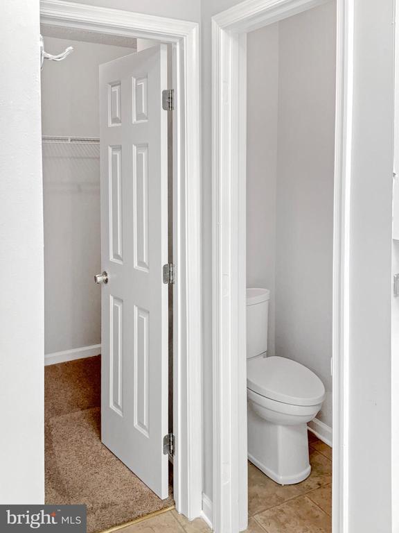 bathroom featuring tile patterned flooring and toilet