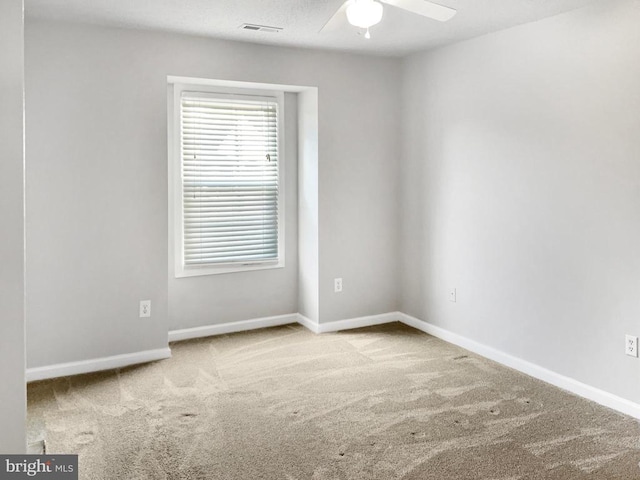 carpeted empty room with ceiling fan