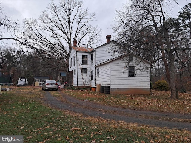 view of side of property featuring a trampoline