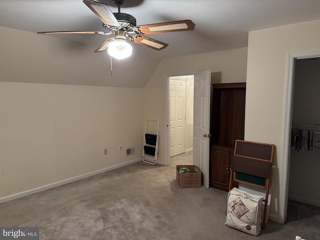 bonus room featuring light carpet, heating unit, vaulted ceiling, and ceiling fan