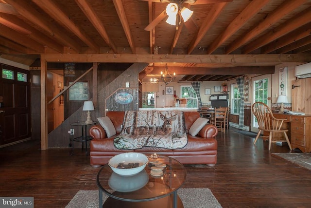 living room featuring beamed ceiling, dark hardwood / wood-style flooring, a wall unit AC, and plenty of natural light