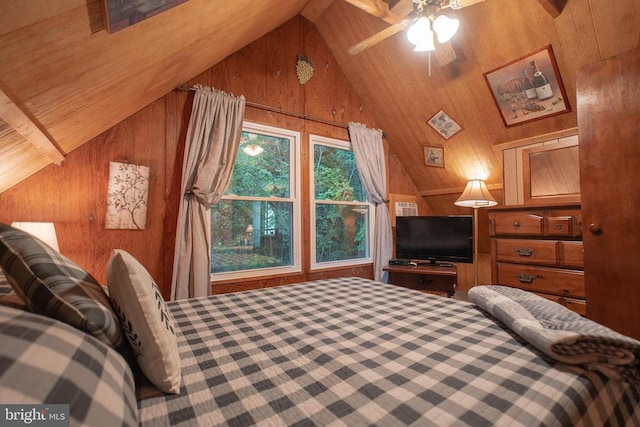 bedroom with wood ceiling, vaulted ceiling, ceiling fan, and wood walls