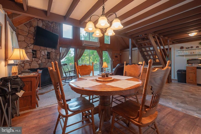 dining space with a chandelier, vaulted ceiling with beams, an AC wall unit, and dark wood-type flooring