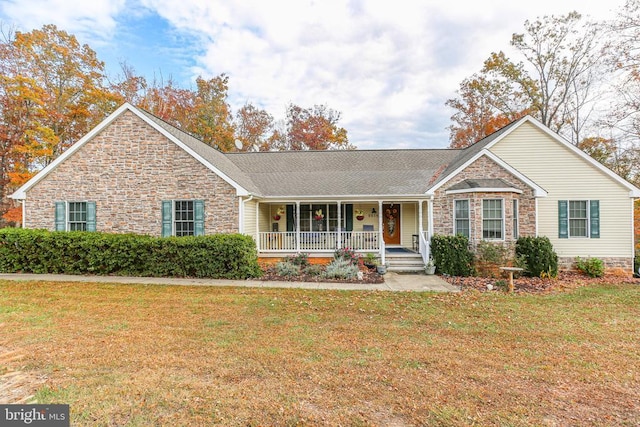 ranch-style home with a front yard and a porch