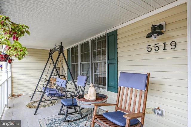 view of patio featuring a porch