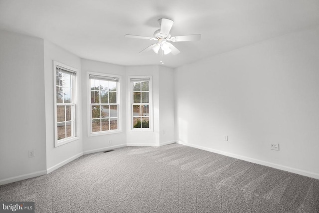 carpeted empty room with ceiling fan