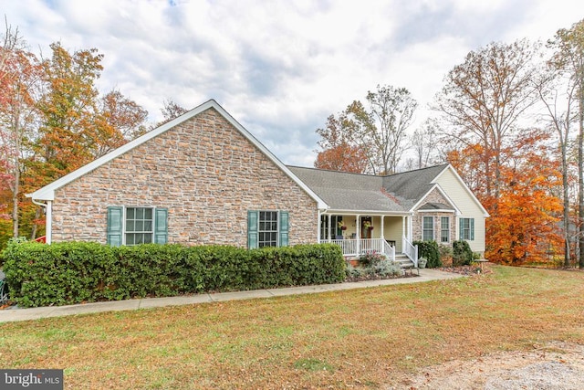 single story home featuring a front lawn and covered porch