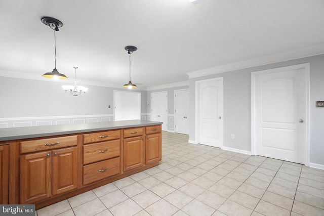 kitchen with light tile patterned flooring, pendant lighting, a notable chandelier, and ornamental molding