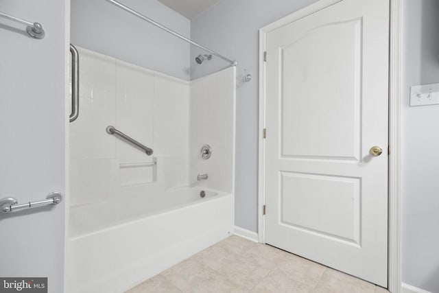 bathroom featuring tile patterned floors and bathing tub / shower combination