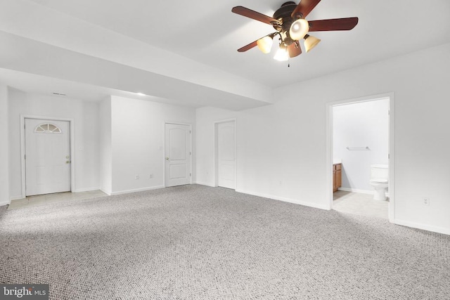 empty room featuring light carpet and ceiling fan