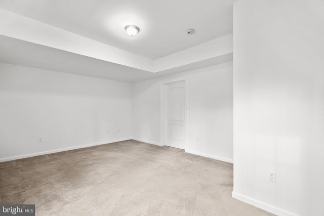 empty room with light colored carpet