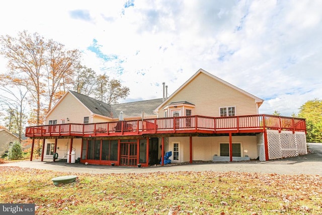 rear view of house with a wooden deck