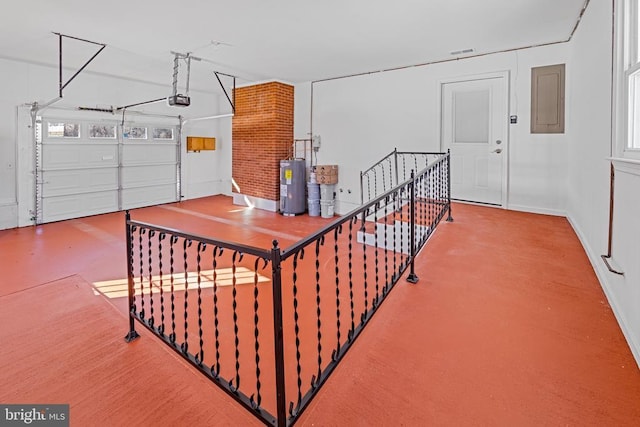 garage with electric panel, electric water heater, and a garage door opener