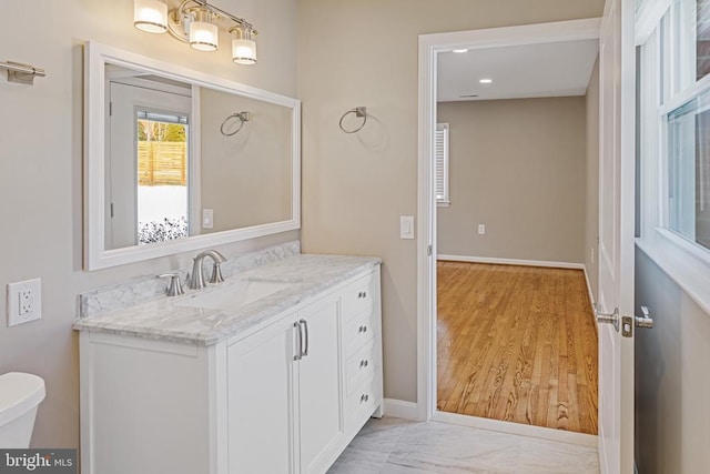 bathroom featuring vanity and toilet