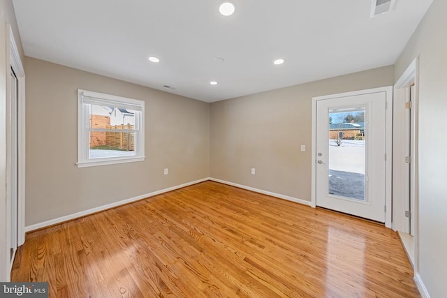 spare room featuring light hardwood / wood-style flooring