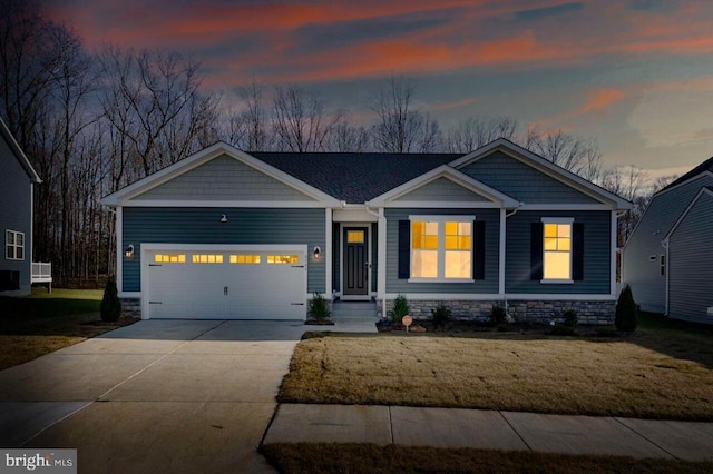 view of front facade with a lawn and a garage