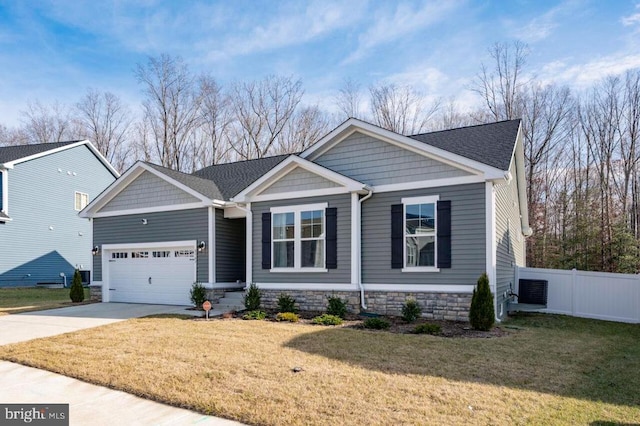 craftsman-style house featuring a front yard and a garage