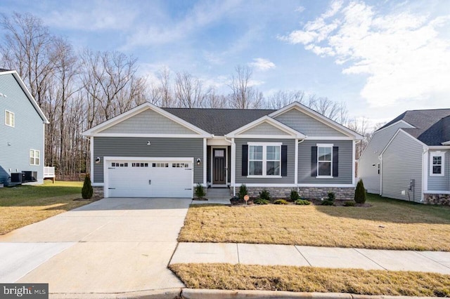 view of front facade with central AC unit, a garage, and a front lawn