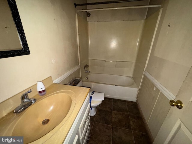 full bathroom featuring tile patterned flooring, vanity, toilet, and shower / bath combination