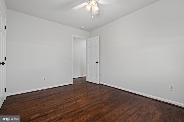 unfurnished room featuring ceiling fan and dark hardwood / wood-style flooring