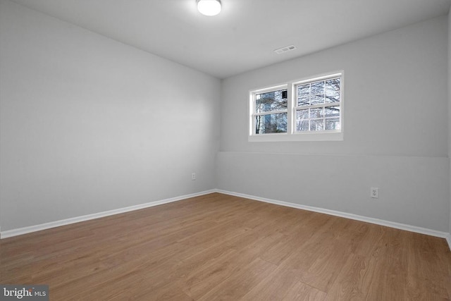 empty room with light wood-type flooring