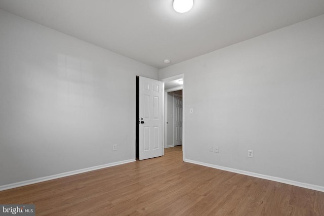 spare room featuring light hardwood / wood-style floors