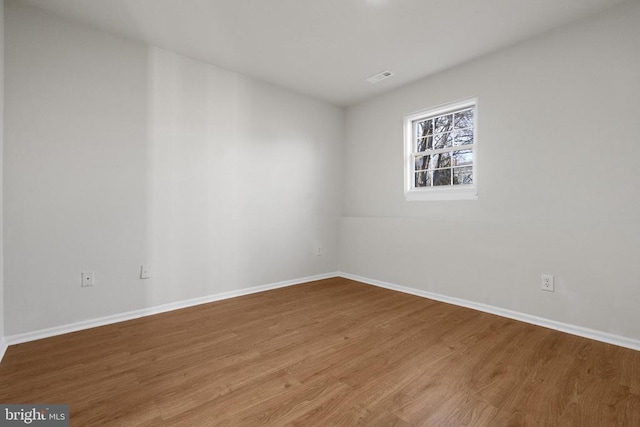 empty room featuring hardwood / wood-style floors