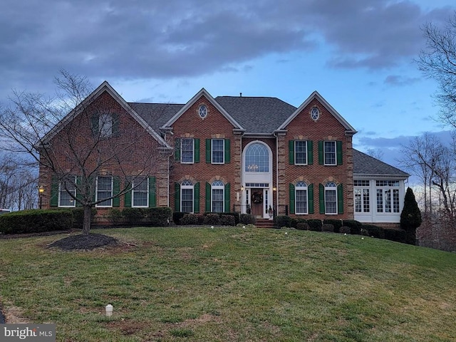 colonial home with a front yard