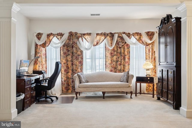 carpeted office with decorative columns